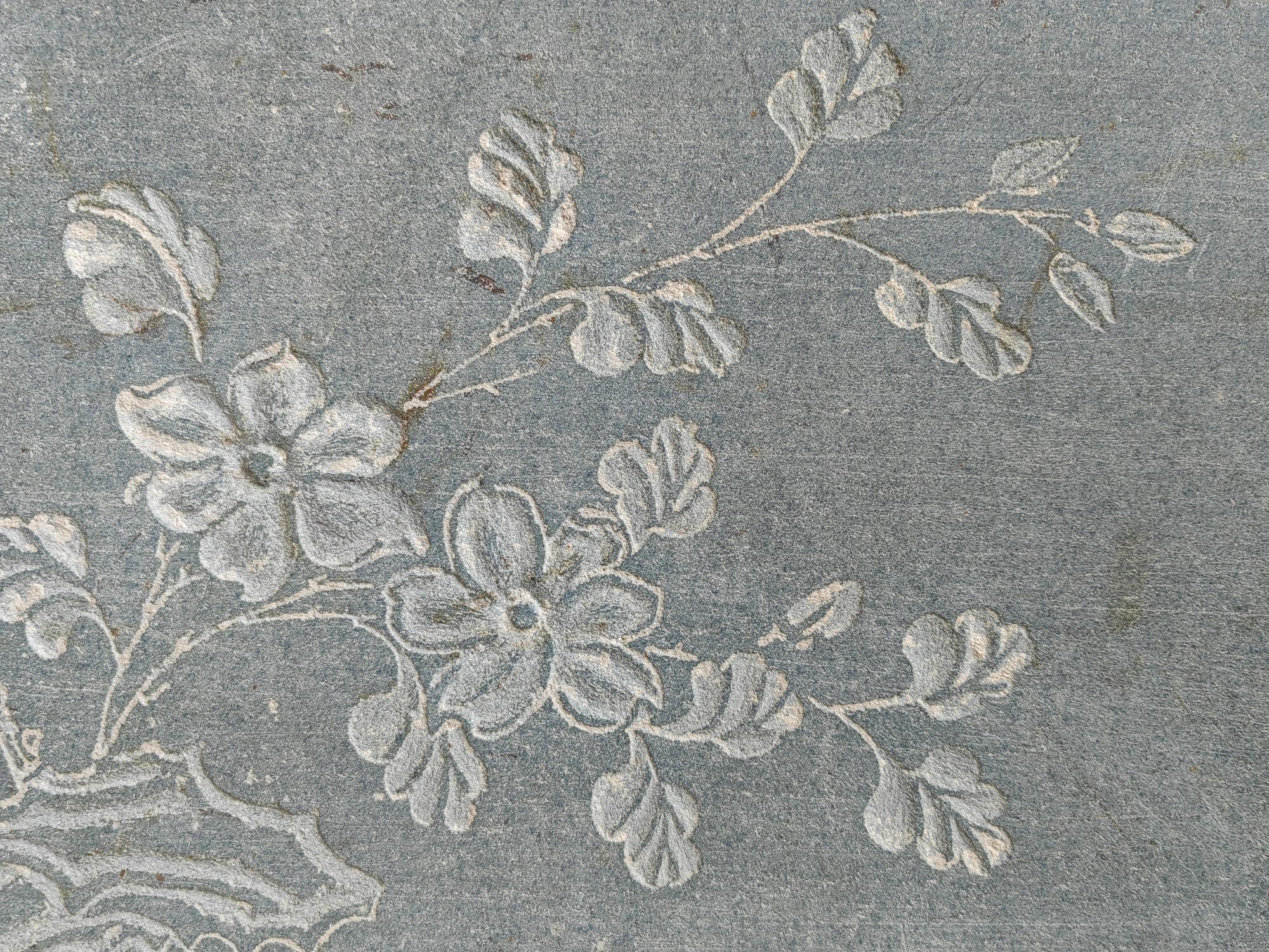 close-up of embroidered floral patch on linen
